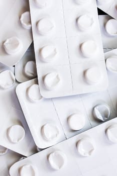White pill packs close up, background or texture