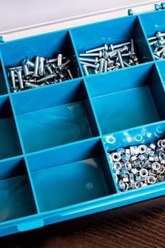 Plastic box with cells on a wooden table
