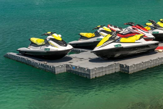 Dubai, UAE - 2 April 2023: Power boats and wave runners in P and O marina at Jumeirah Beach