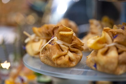 pancake bag with filling on the buffet table with snacks.