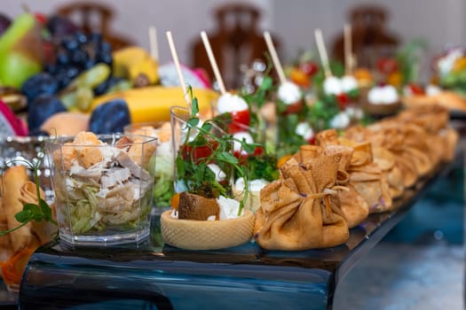 pancake bag with filling on the buffet table with snacks.