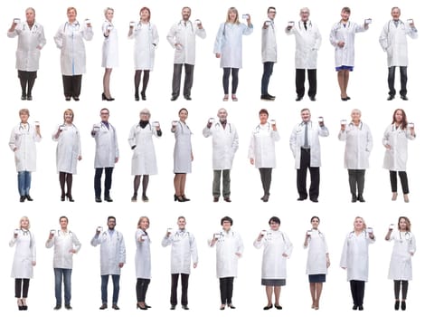 full length group of doctors showing badge isolated on white background