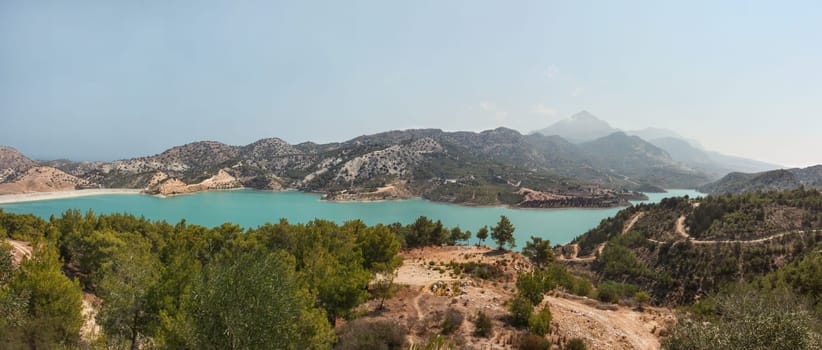 Panorama of Gecitkoy (Dagdere) dam with turquoise water near Kyrenia, Northern Cyprus.