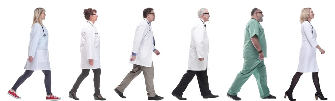 group of doctors in motion isolated on white background