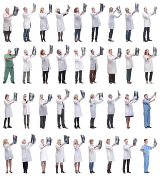 group of doctors holding x-ray isolated on white background