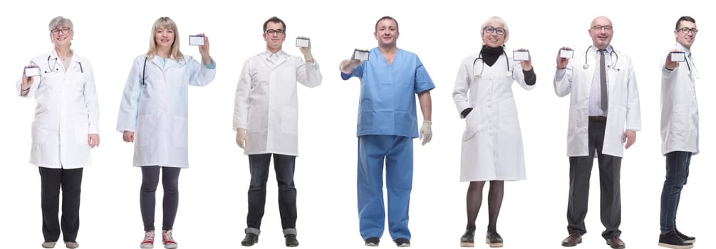 full length group of doctors showing badge isolated on white background