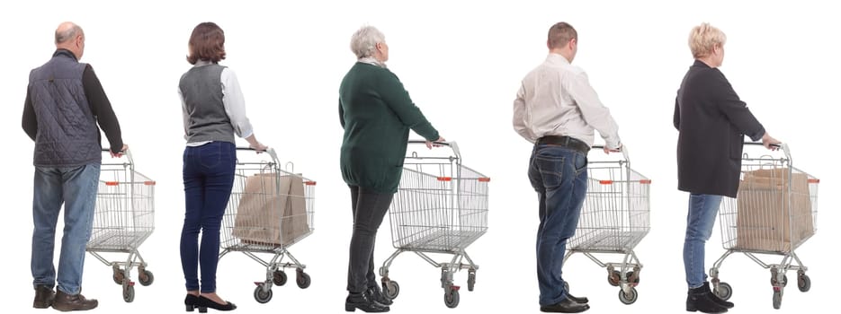 a group of people with a cart stand with their backs isolated on a white background