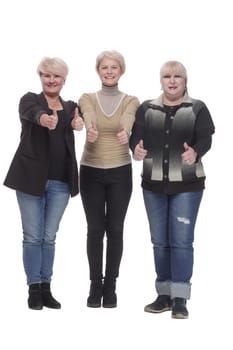 in full growth. three happy women standing together. isolated on a white background.