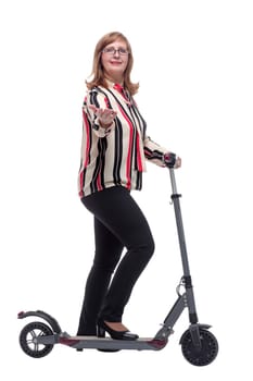 side view. modern casual woman with an electric scooter. isolated on a white background