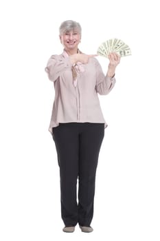 in full growth. friendly old woman with a fan of dollar bills . isolated on a white background.