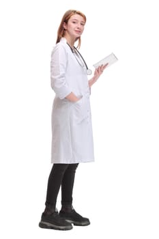 Side view of smiling woman medicine doctor holding computer tablet in hand with copy space on white background