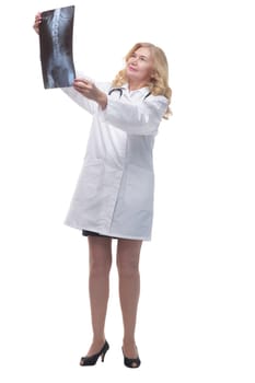 in full growth. female doctor with an x-ray. isolated on a white background.