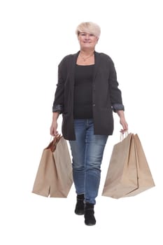 full-length. casual mature woman with shopping bags . isolated on a white background.