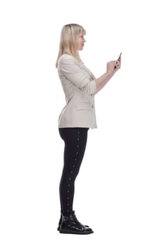 side view. casual woman choosing the right contact on her smartphone. isolated on a white background.