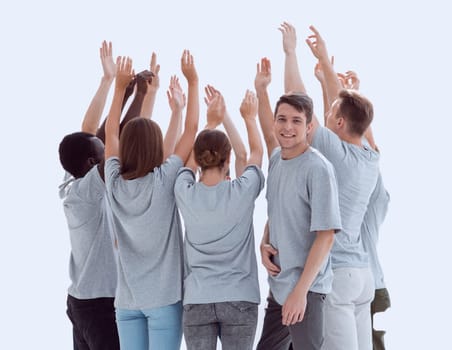 in full growth. group of young people standing in a circle with hands up. photo with copy space