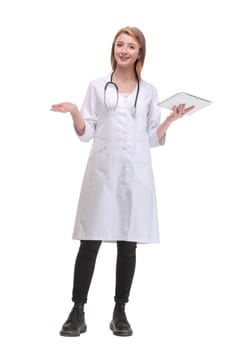 Full lenth portrait of a happy young doctor working with a tablet, on white background