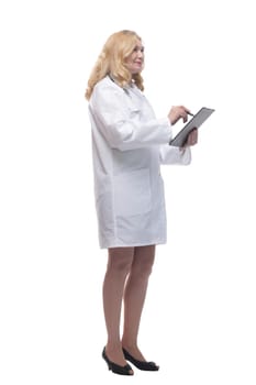 side view. friendly female doctor with clipboard looking at white screen. isolated on a white background.