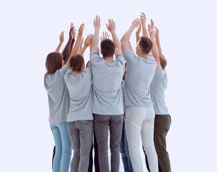 in full growth. group of young people standing in a circle with hands up. photo with copy space