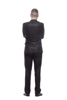 rear view. handsome young businessman. isolated on a white background.