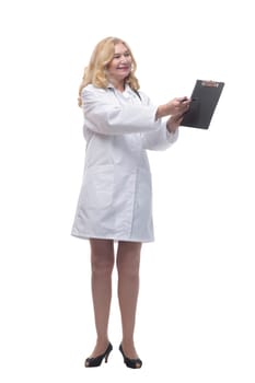 in full growth. friendly female doctor with clipboard looking at you . isolated on a white background.