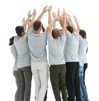 in full growth. group of young people standing in a circle with hands up. photo with copy space