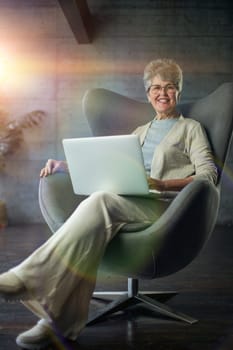 woman sitting in a chair in Art Nouveau style. Business, elegant businesswoman working on laptop . Interior, furniture.
