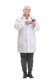 A full-length shot of a doctor woman sending a message with the mobile over isolated white background