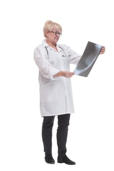 in full growth. competent doctor with an x-ray. isolated on a white background.