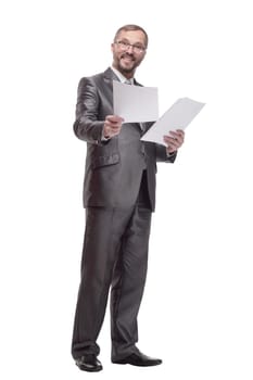 in full growth.Executive business man with documents. isolated on a white background.