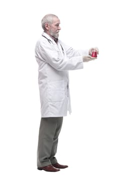 elderly competent doctor with a laboratory flask in his hands. isolated on a white background.