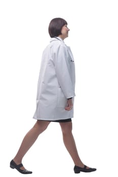 side view. confident female paramedic striding forward. isolated on a white background.