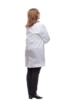 side view. serious female medic looking at a white screen. isolated on a white background