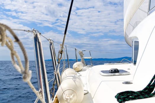 Sailboat sailing in the Mediterranean Sea at sunny summer day. Cruising luxury yacht. Vacation in Croatia, Italy, Greece