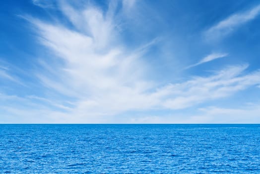 Blue sea and white clouds on sky. Water cloud horizon background. Feeling calm, cool, relaxing. The idea for cold background and copy space on the top. the ocean deep indigo