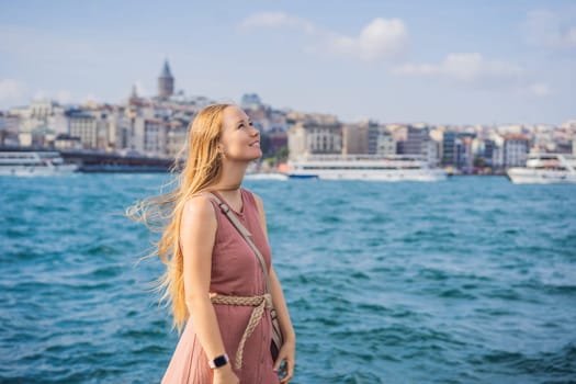 Portrait of beautiful woman tourist with view of Galata tower in Beyoglu, Istanbul, Turkey. Turkiye.