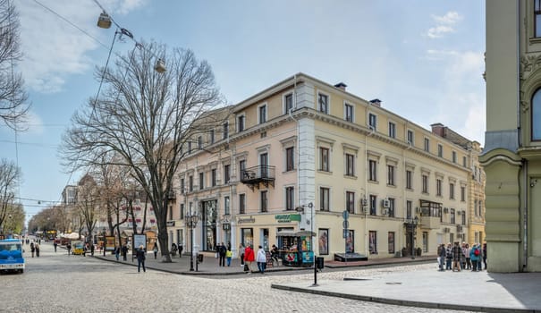 Odessa, Ukraine 15.04.2023. Historic apartment building on the Deribasovskaya street in Odessa, Ukraine, on a sunny spring day