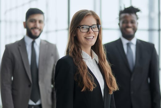 Portrait of successful happy business team posing at office