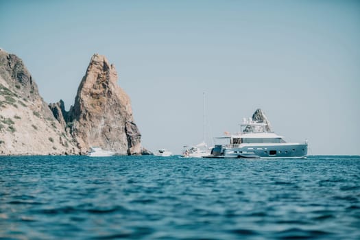 Aerial boat race. Luxury cruise trip. View from above of white boat on deep blue water. Aerial view of rich yacht sailing sea. Motor boat racing wave. Summer journey on luxury ship