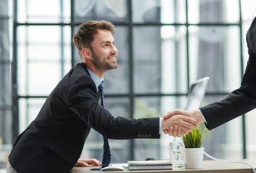 businessman handshake for teamwork of business merger and acquisition