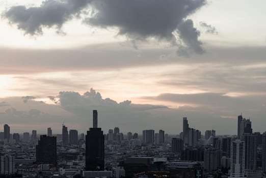 Bangkok, Thailand - Aug 14, 2022 - Gorgeous scenic of the sunset with cloud on the sky over large metropolitan city in Bangkok. Nice city view, Space for text, No focus, specifically.