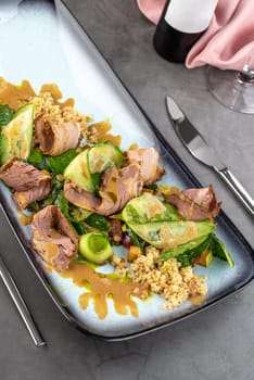 Pastrami salad on stone table in fine dining restaurant