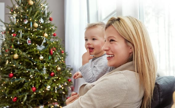 Motherhood is one of the most precious gifts and callings. a young mother enjoying Christmas with her little boy