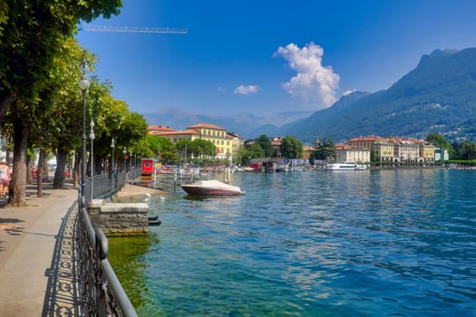 Panoramic view of the lake from the promenade with Lugano town in the background.