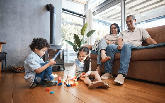 Grandparents, toys and children on floor playing for relaxing, educational game and learning. Child development, family home and happy grandpa, grandmother and kids for quality time, bonding and love.