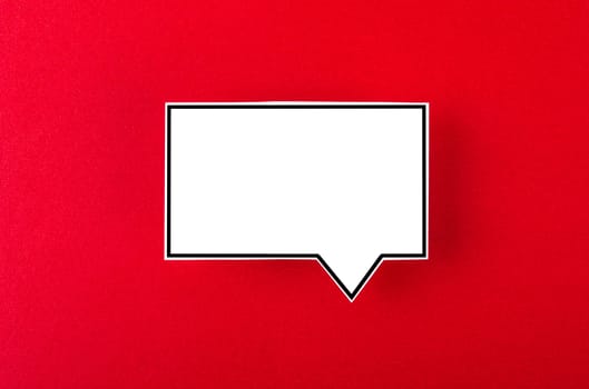 Speech bubble with copy space communication talking speaking concepts on red background.