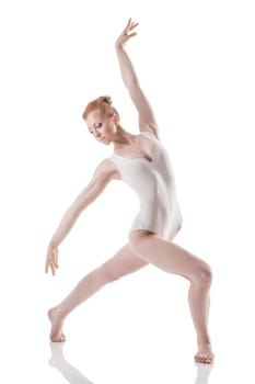 Image of elegant young woman dancing in studio, isolated on white