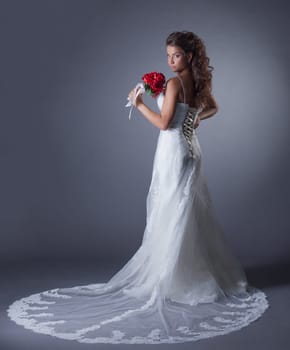 Image of charming bride posing in elegant dress, close-up