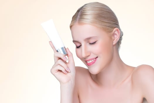 Closeup personable beautiful perfect natural skin woman hold mockup tube moisturizer cream for skincare treatment product advertising expressive facial and gesture expression in isolated background.