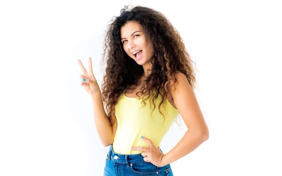 Attractive young girl showing victory gesture