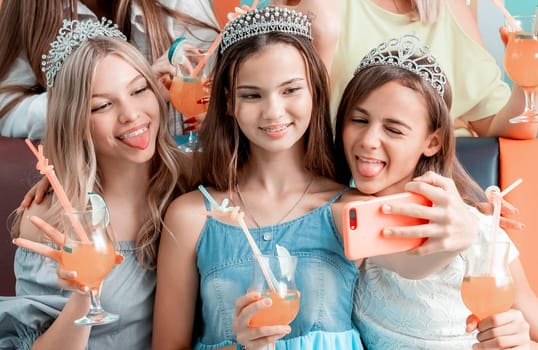 Funny girls taking selfie at birthday celebration